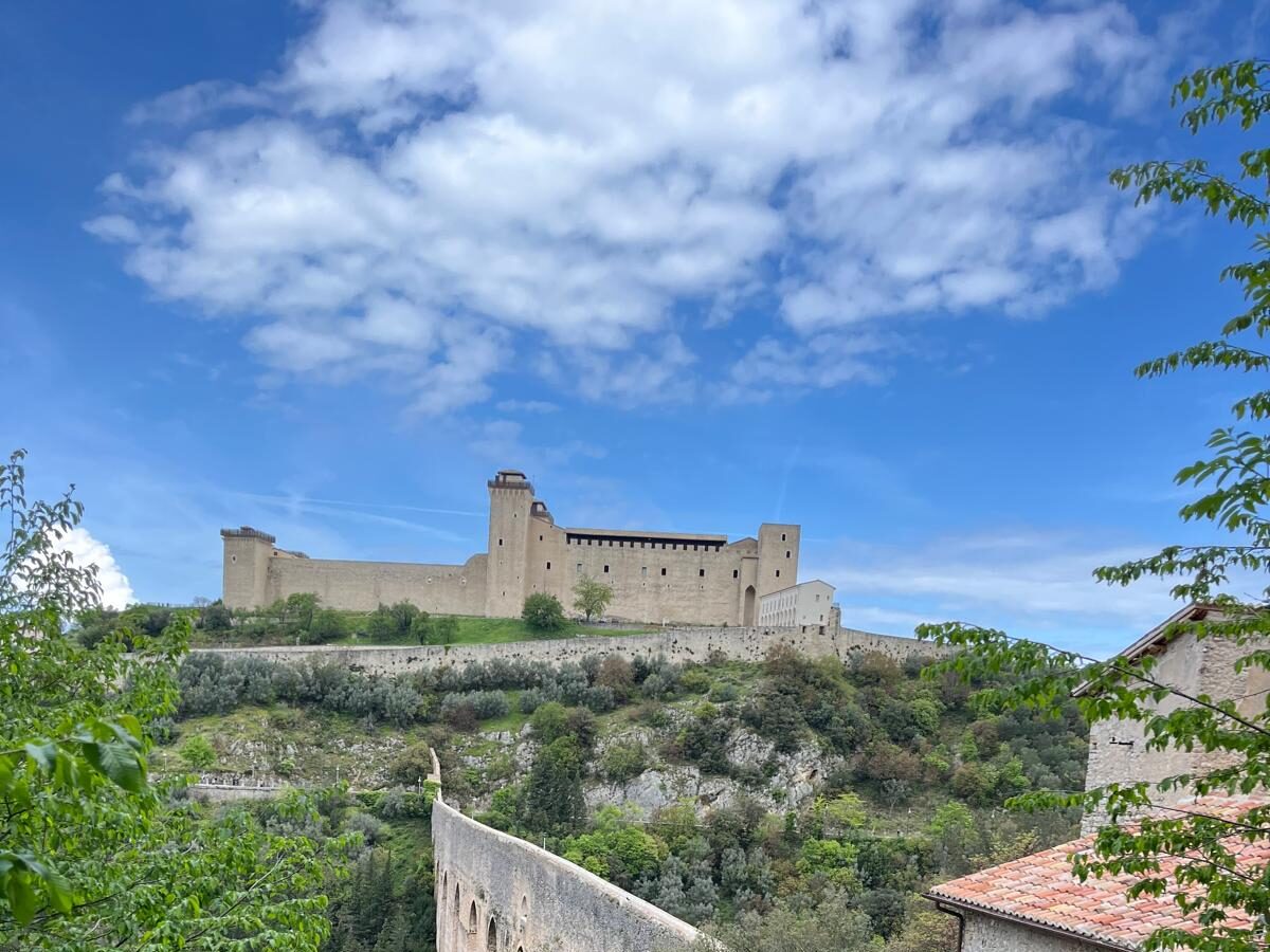 Ponte delle Torri bridge in Spoleto surrounded by lush green valleys