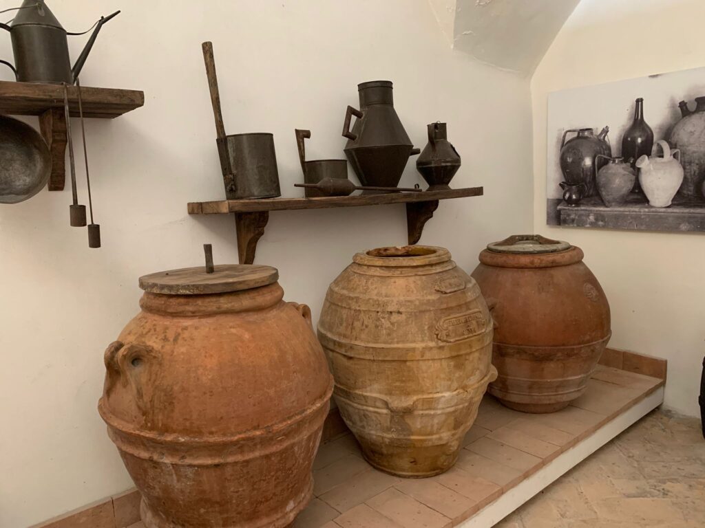 Ancient terracotta jars used to store olive oil, displayed at the Olive Oil Museum in Trevi, Umbria, Italy