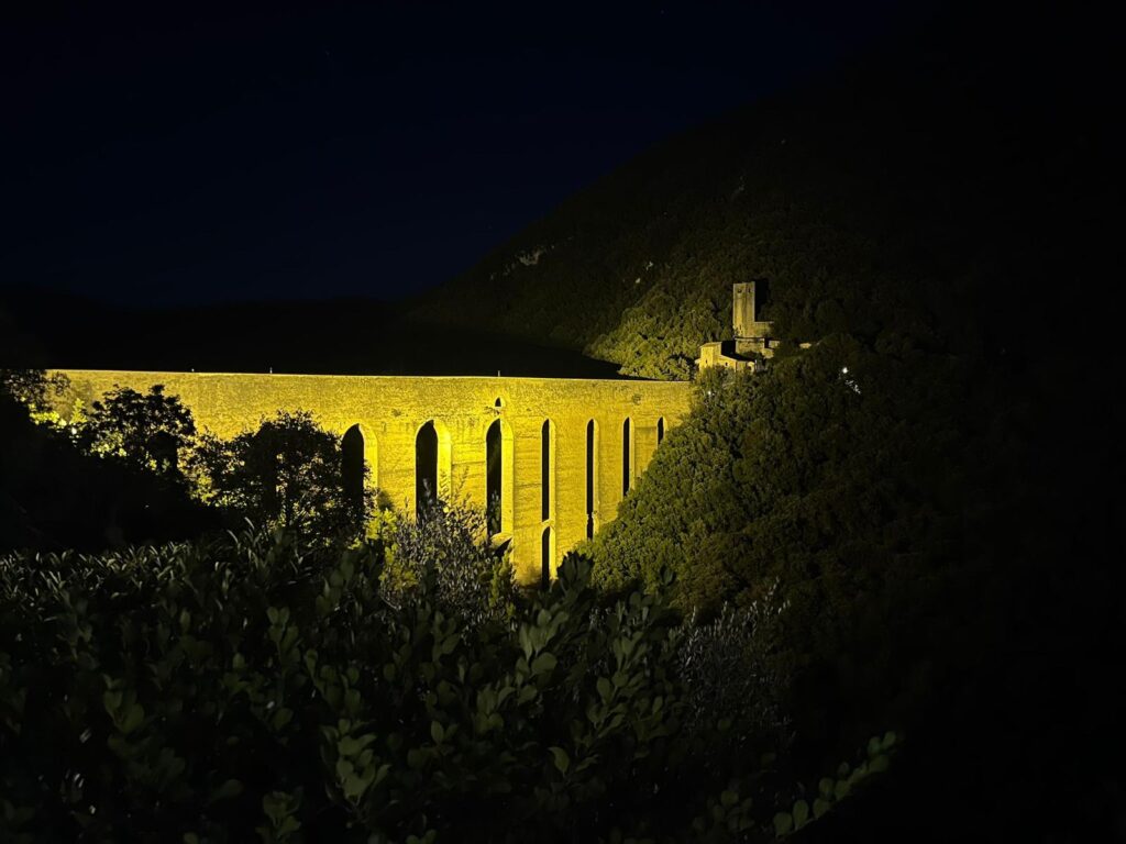 Bridge of Towers in Spoleto at night – illuminated medieval aqueduct and landmark in Umbria, Italy